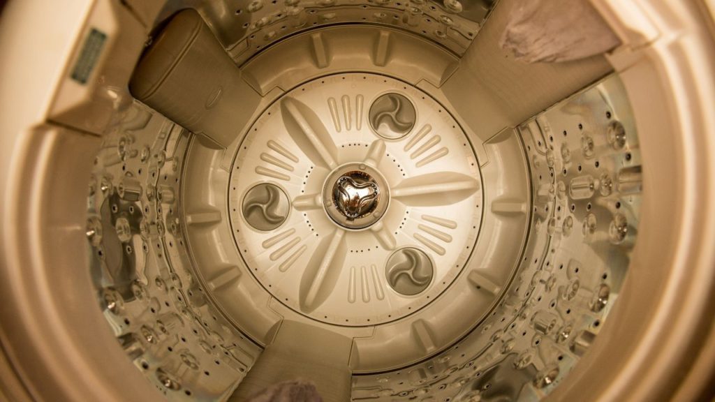 Inside of an impeller washing machine.