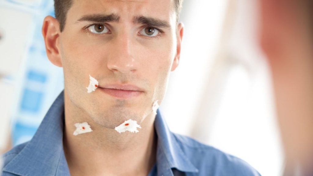 Man with shaving cuts