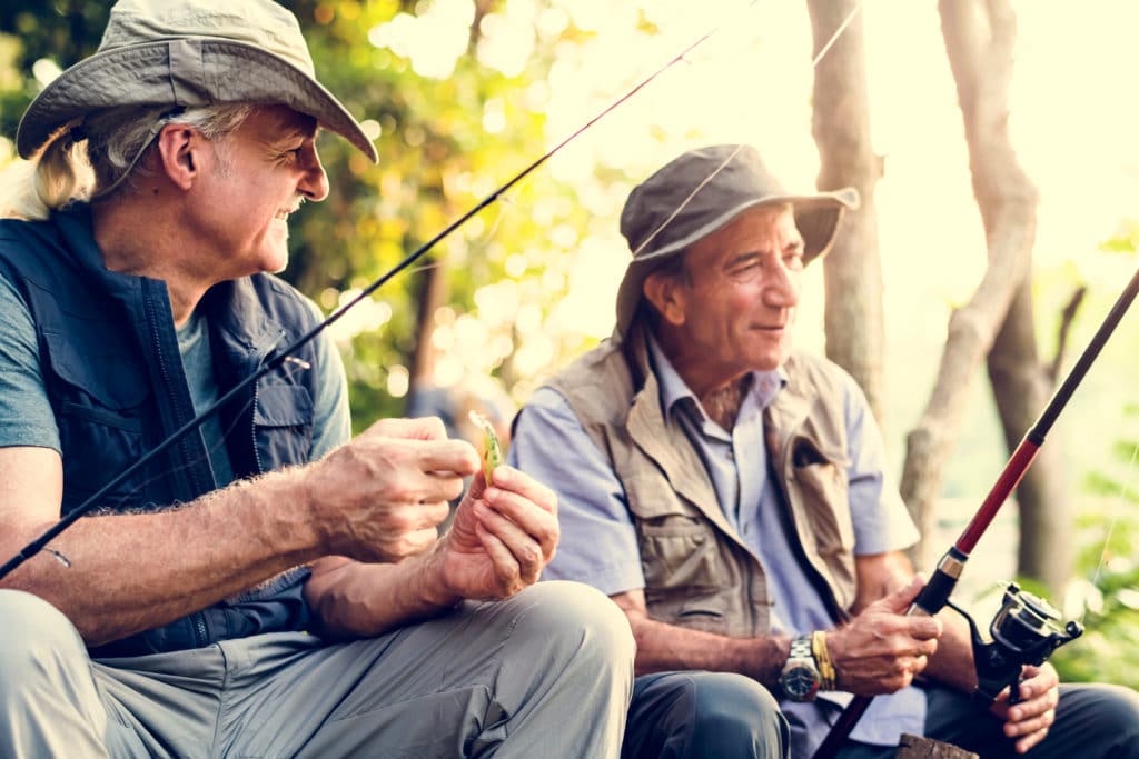 Senior,friends,fishing,by,the,lake