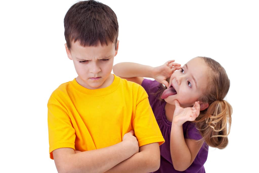 Young,girl,mocking,angry,boy, ,isolated