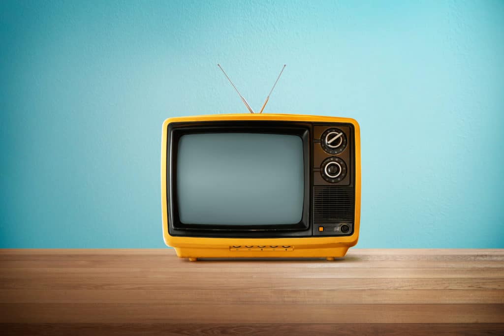 Yellow,orange,color,old,vintage,retro,television,on,wood,table