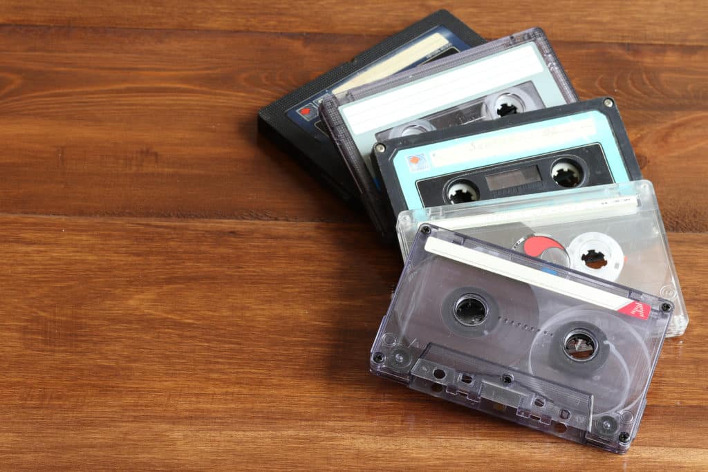 Old,cassettes,for,a,cassette,tape,recorder,on,a,wooden