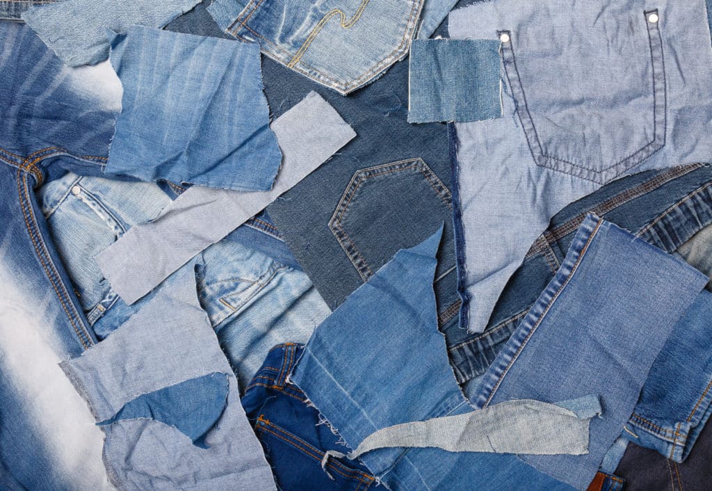 Old,denim,garbage,background.,recycling,old,jeans.,old,blue,jeans