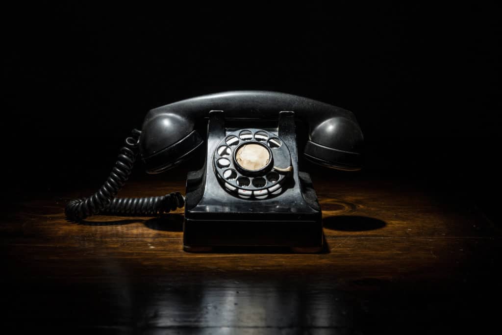 Antique,vintage,black,timey,old,rotary,phone,in,dark,contrasty