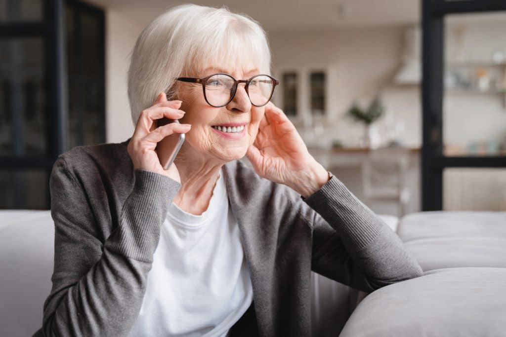 Happy,smiling,caucasian,old,senior,elderly,woman,lady,grandmother,talking