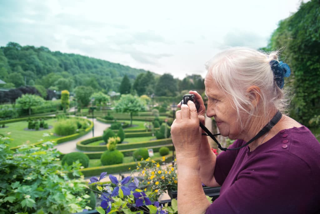 Portrait,of,a,happy,caucasian,senior,woman,taking,photo,in