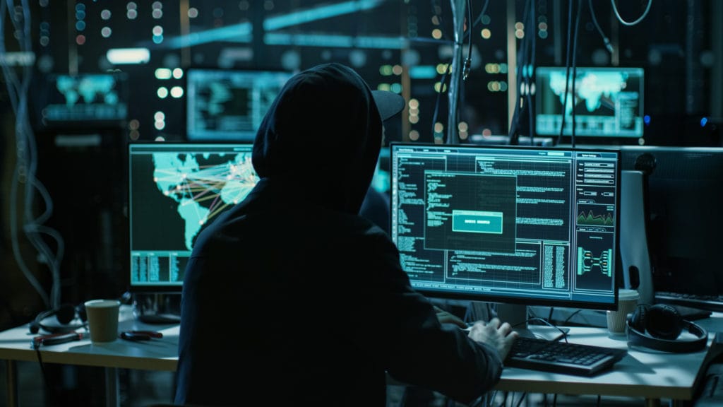 Teenage Hacker Working with His Computer Infecting Servers and I
