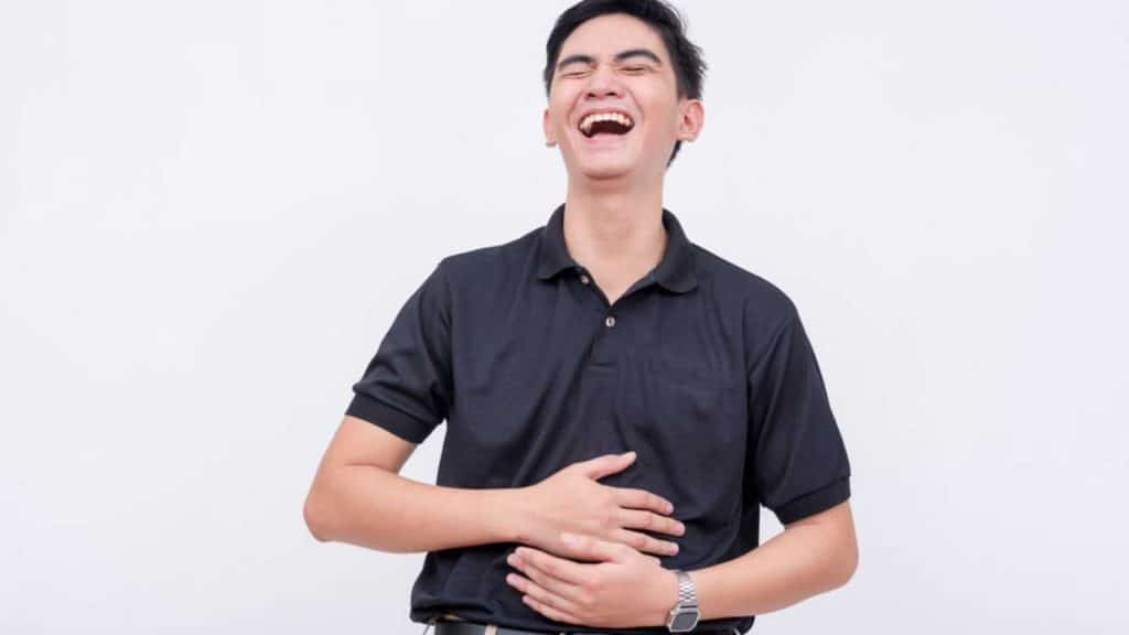 Man Laughing With Hurting Stomach