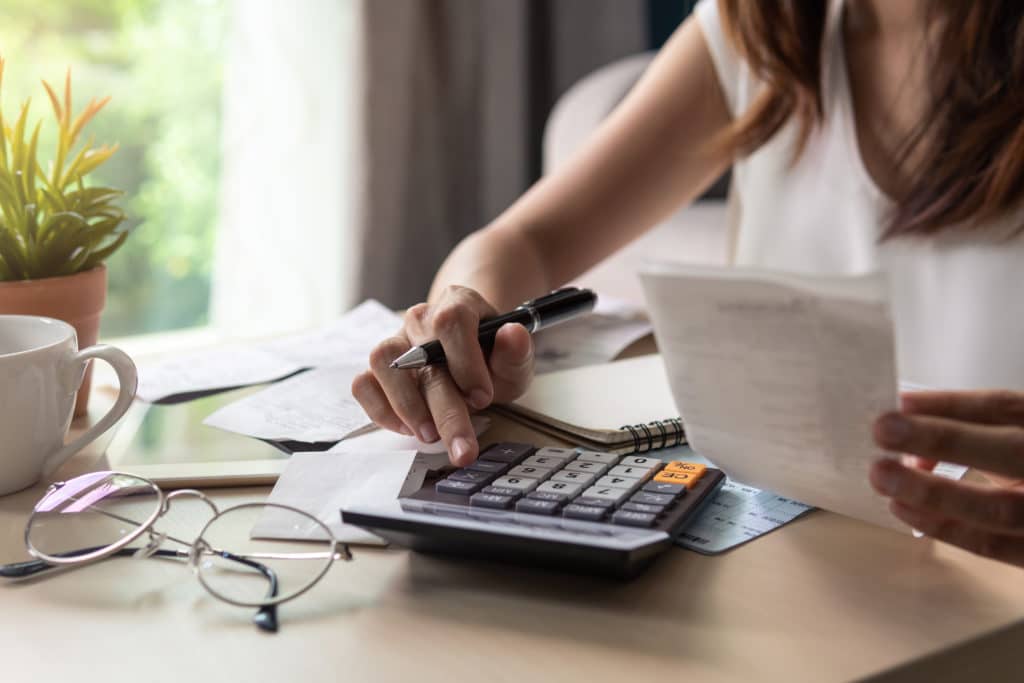 Stressed Young Woman Calculating Monthly Home Expenses Tax Bank Account