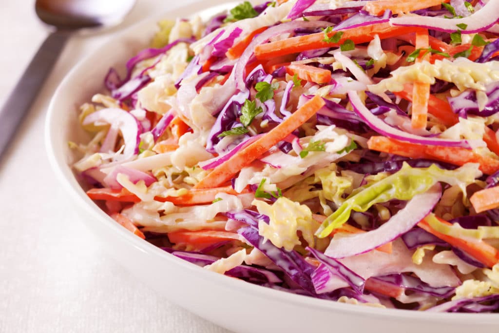 A Family Size Bowl Of Healthy Coleslaw Made With Green