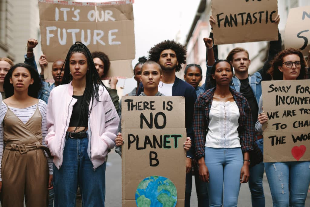 Group Of Activists With Banners Protesting To Save Earth. Men