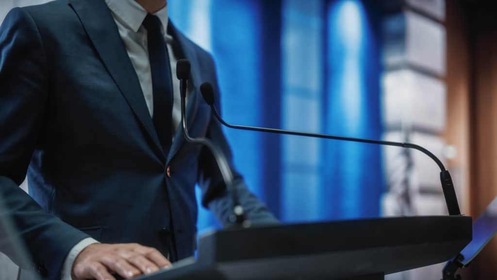 Close,up,of,a,organization,representative,speaking,at,press,conference