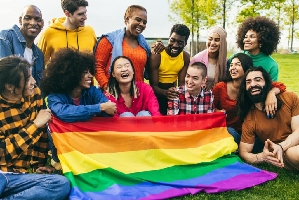 Diverse People Having Fun Holding Lgbt Rainbow Flag Outdoor 