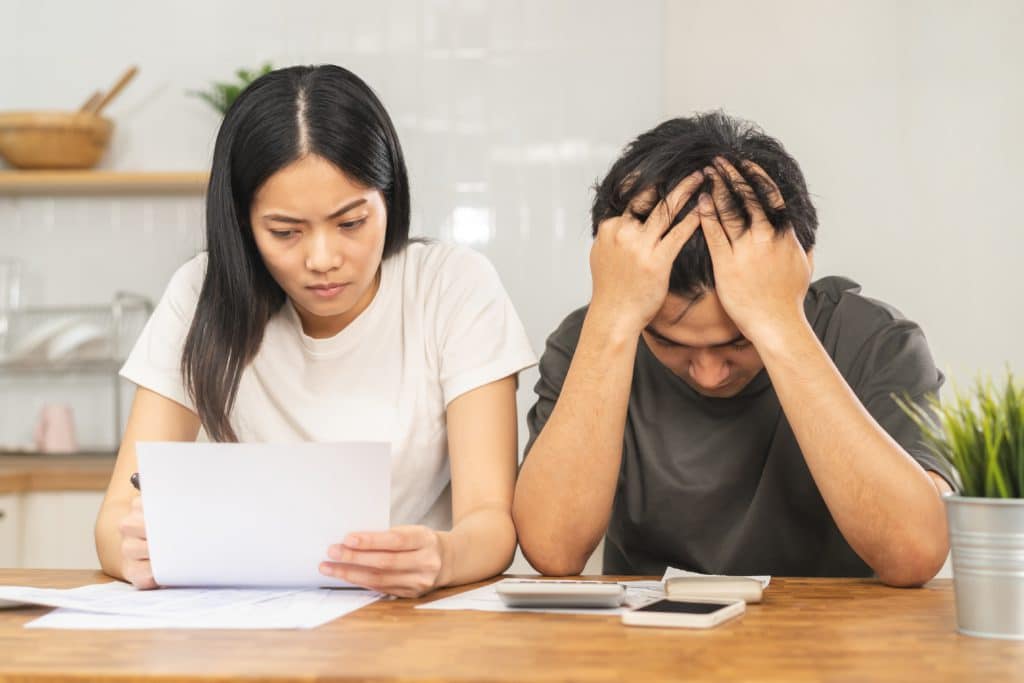 Stressed Asian Young Couple Family Wife And Husband Confused By