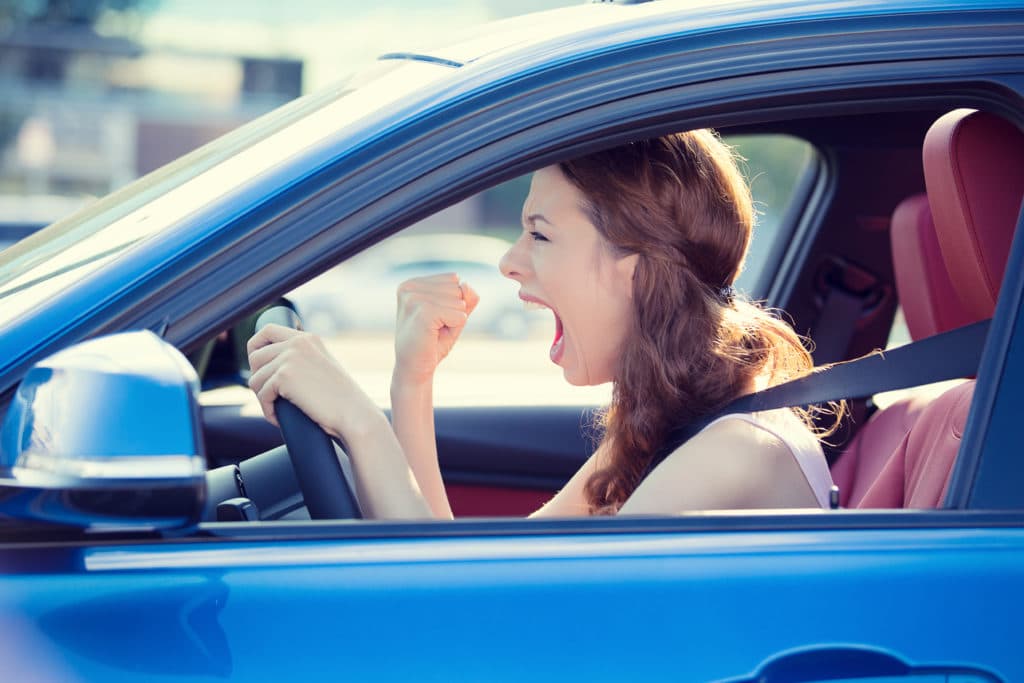 Angry woman driving car