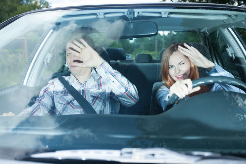 Young Couple In Car Blinded By High Beam Lights