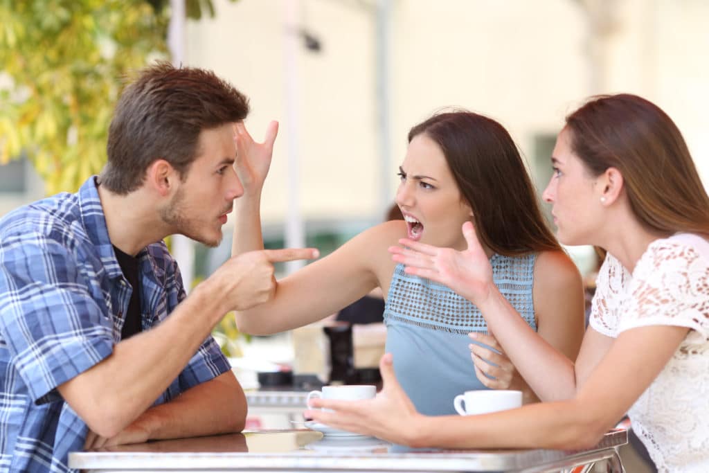 Discussion,of,three,angry,friends,arguing,in,a,coffee,shop