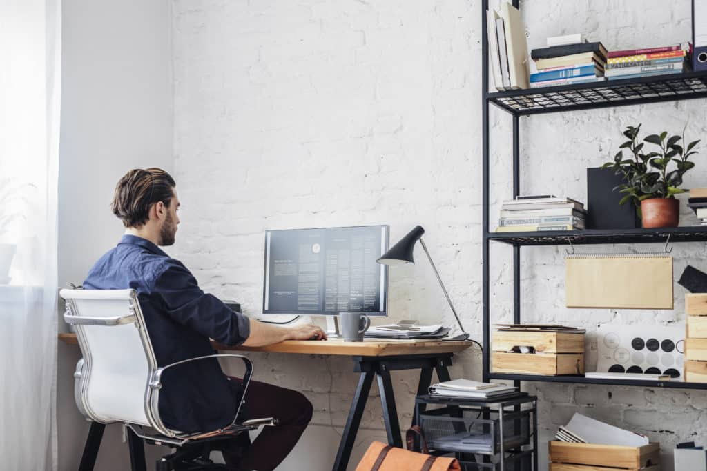 Young Man Working On His Computer