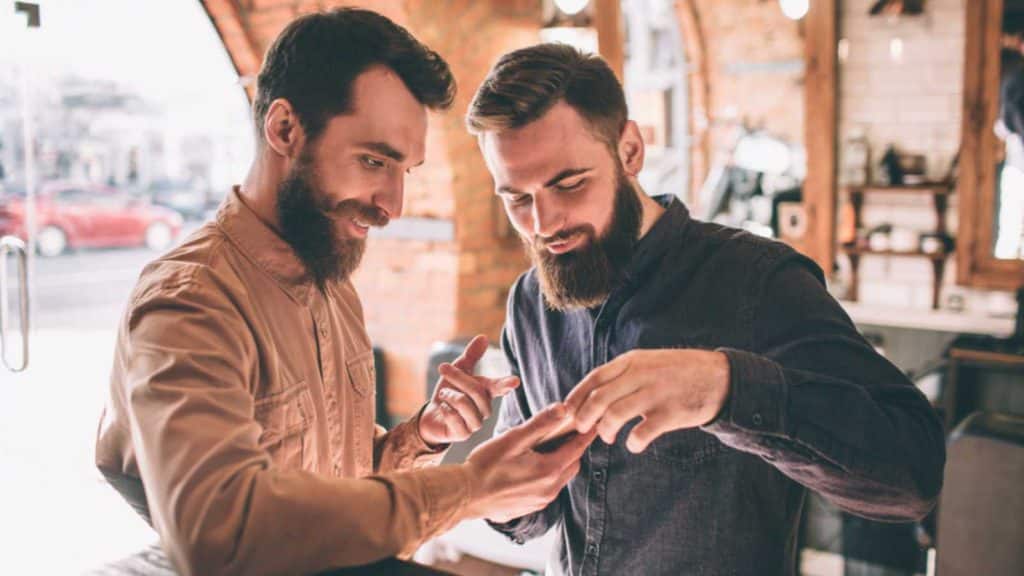 Happy Friends Looking At Mobile