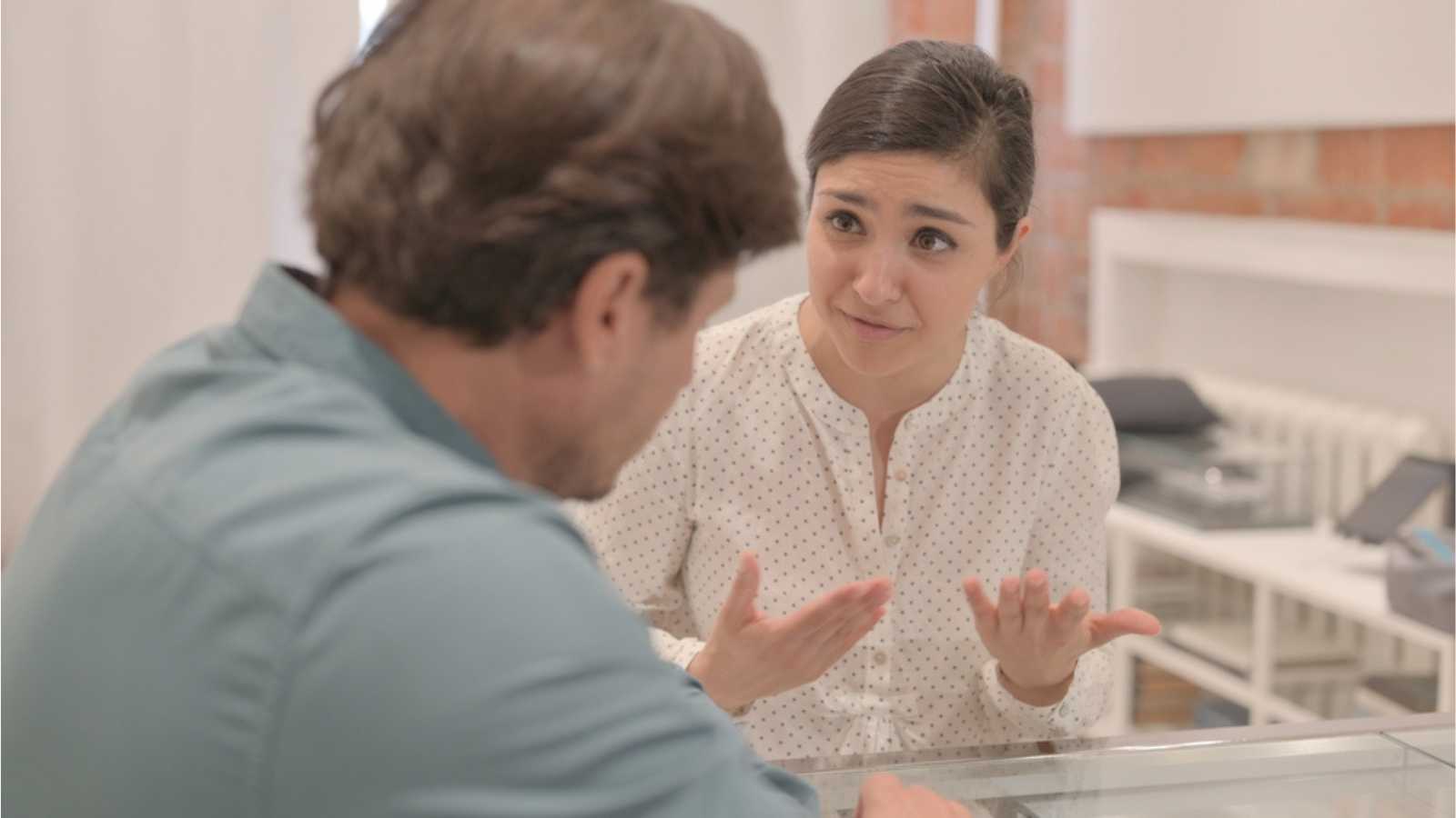 Woman Explaining To Husband