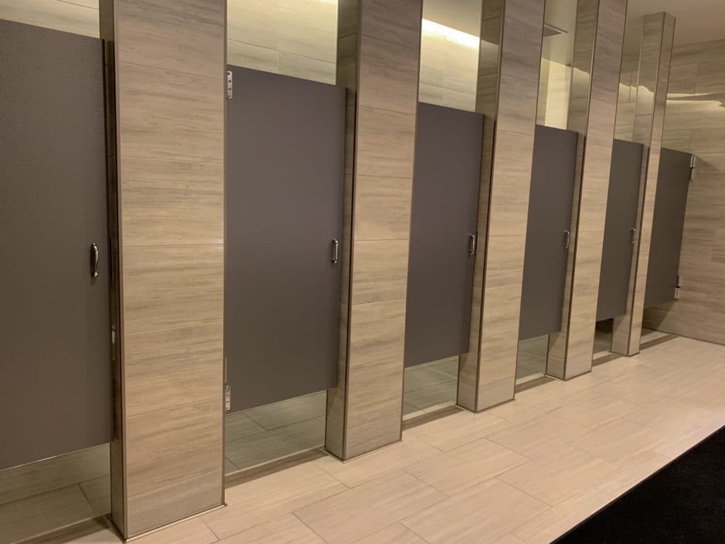 Row Of Public Modern Bathroom Stalls.
