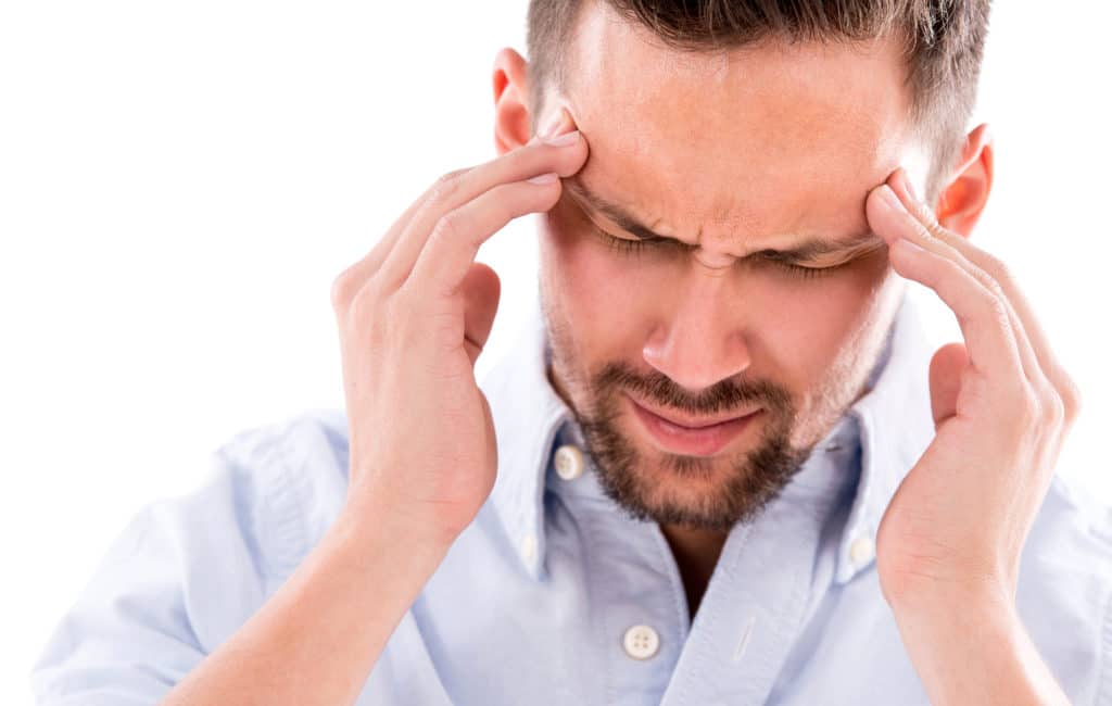 Frustrated Business Man With A Headache Isolated Over White