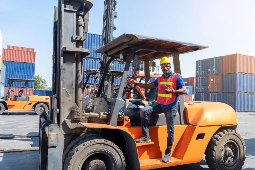 African American Forklift Driver With Safety Equipment Safety Vest And