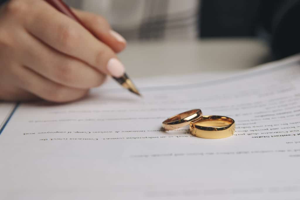 Woman Signing Marriage Contract Closeup