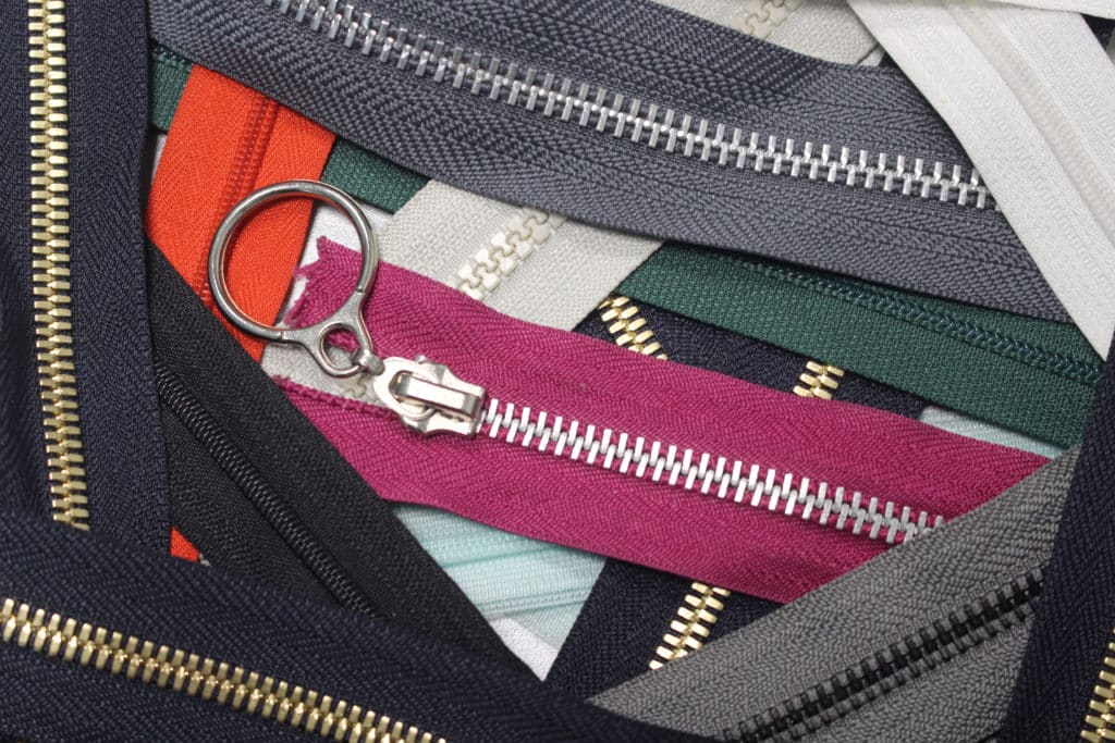 Collection Of Zippers Of Different Colors And Variants In The
