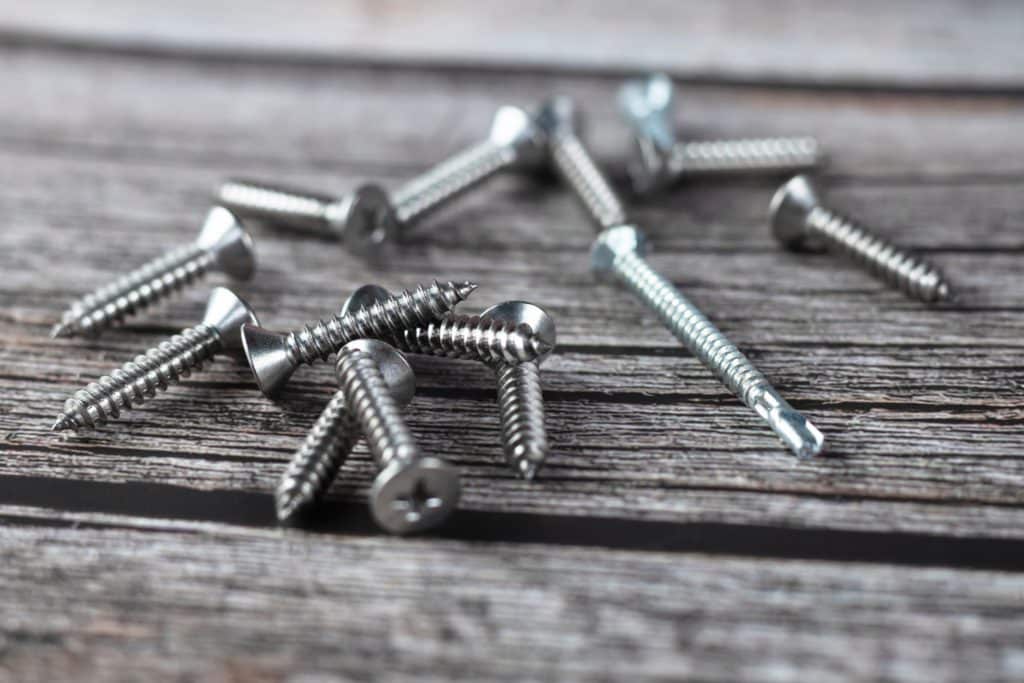 Tapping Screws Made Of Steel On Wood Background Metal Screw 