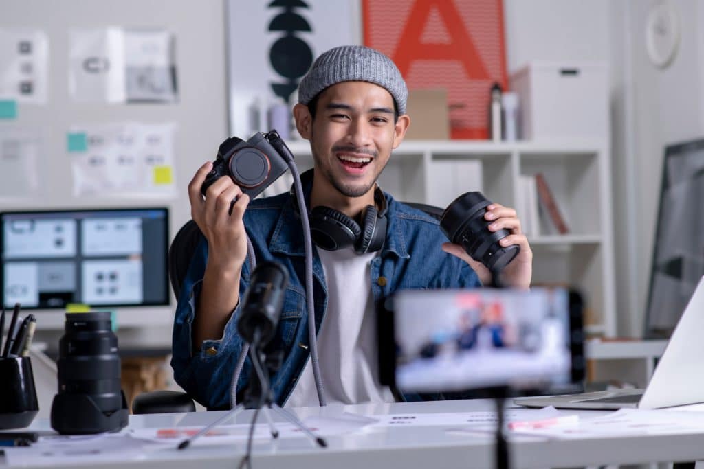 Young Asian Man Graphic Designer Blogger Influencer Filming Teaching Camera