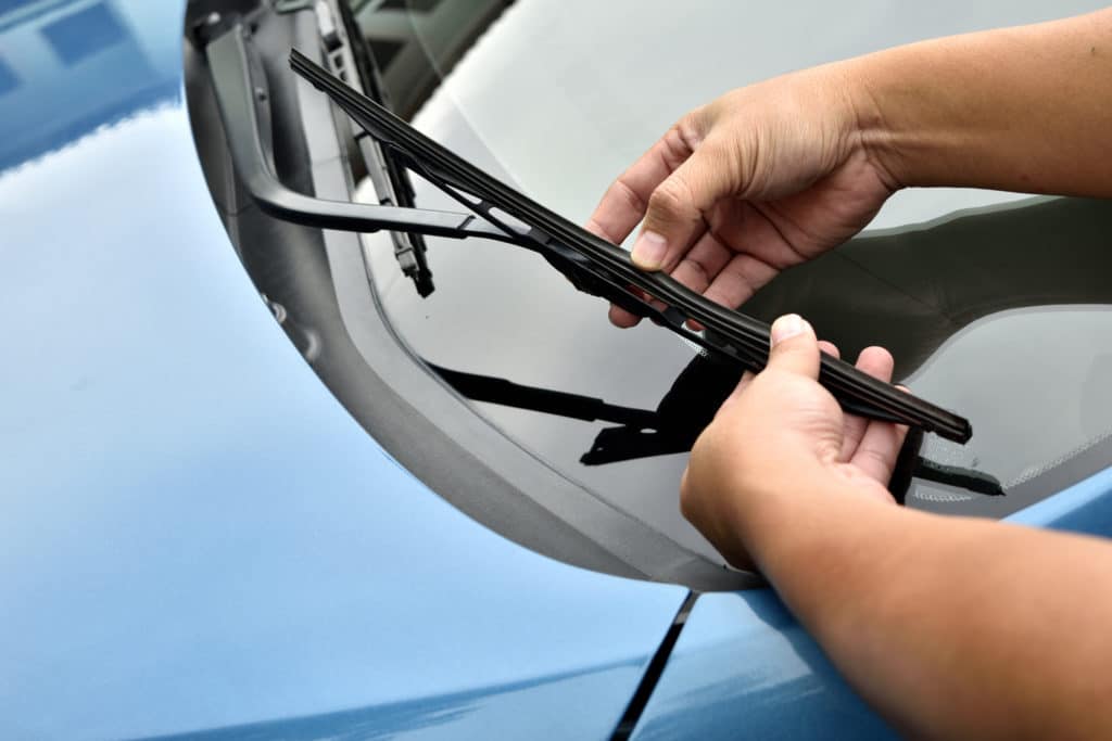 Man Hand Picking Up Windscreen Wiper Or Mechanic Check Old