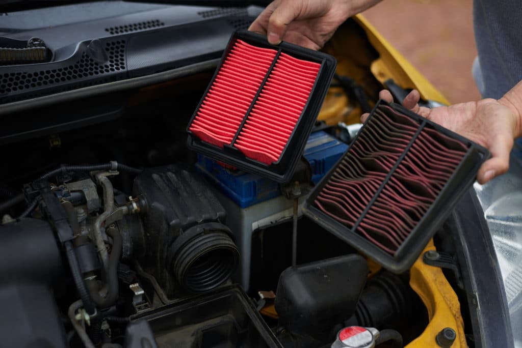 Comparison New And Used Air Filter For Car With Engine