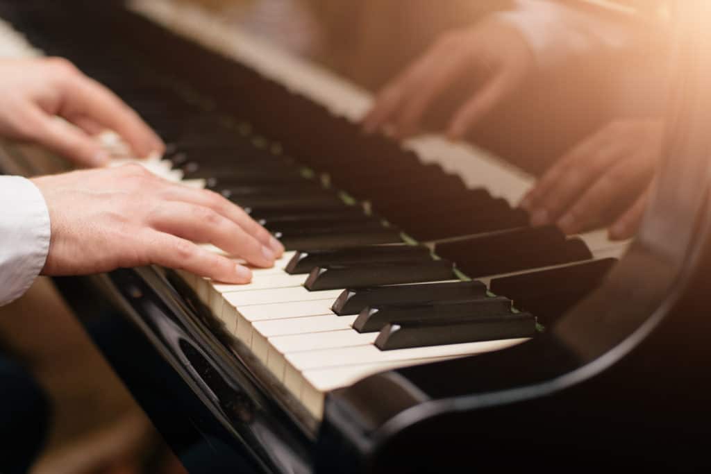 Close Up Of A Music Performer's Hand Playing The Piano