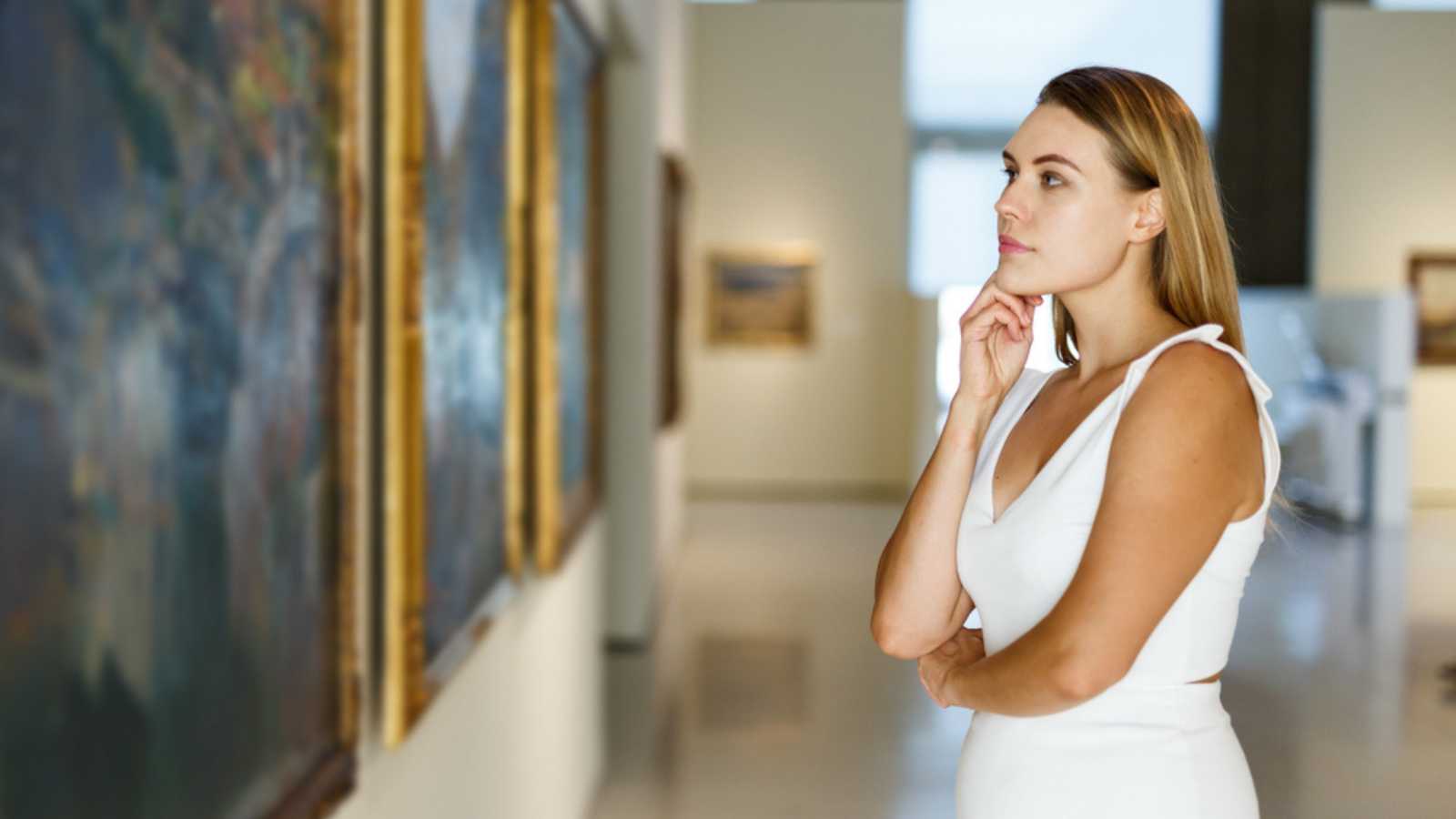 Woman Looking At Painting And Thinking