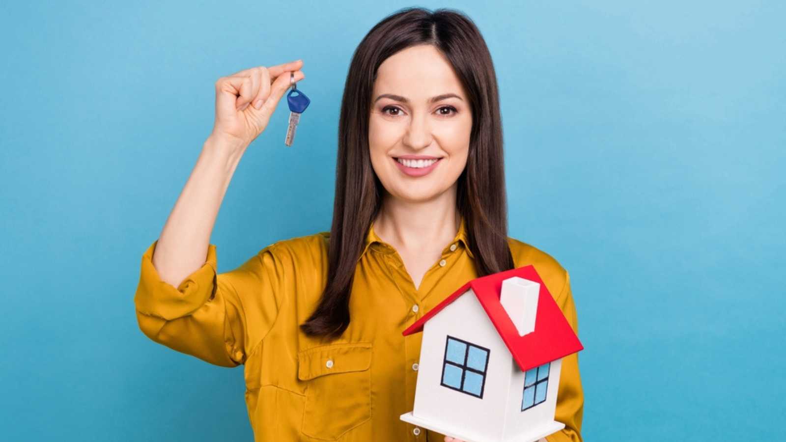 Woman With Toy House And Key