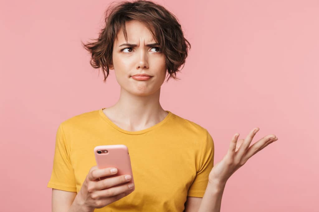 Image Of A Confused Young Beautiful Woman Posing Isolated Over