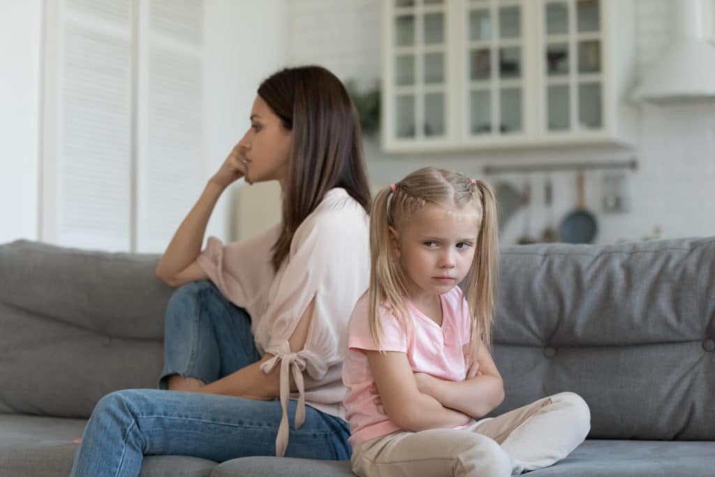 Sulking Daughter Dissatisfied Mother Sitting On Couch Looking Different Sides 