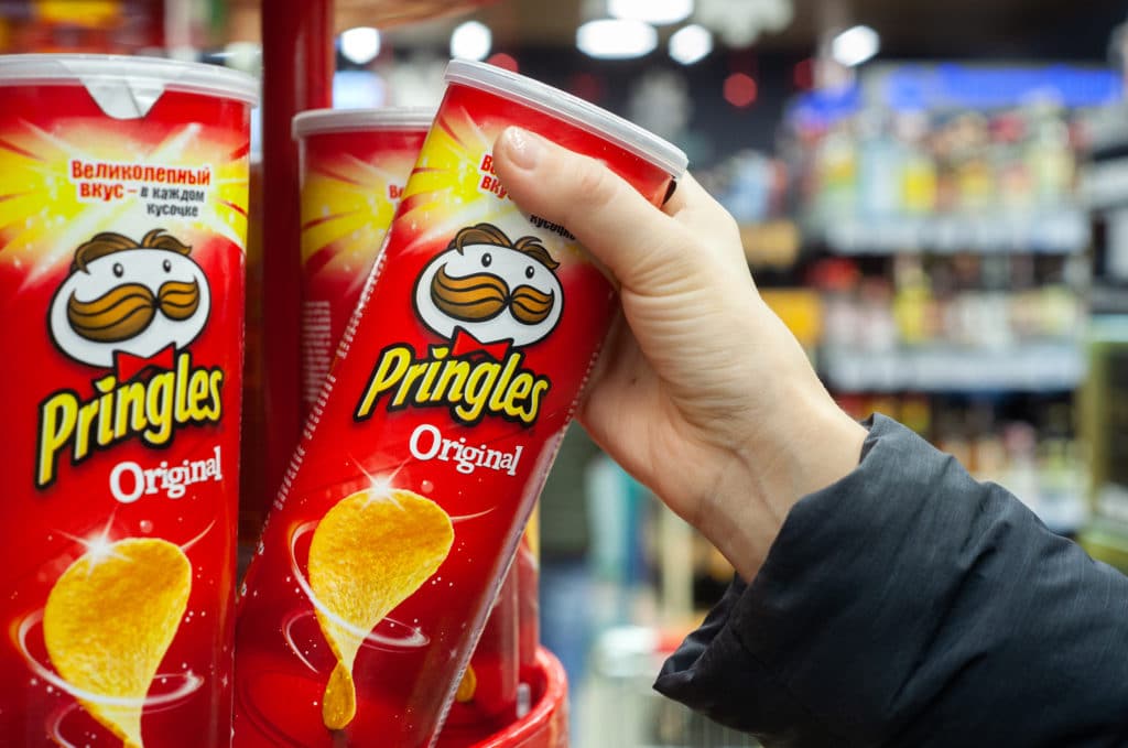 Minsk Belarus December 19 2019: A Buyer Buys Pringles