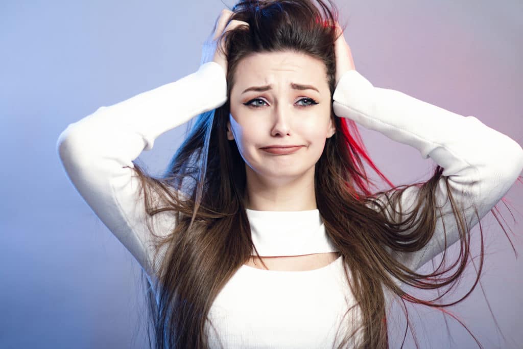 Portrait Of A Beautiful Shocked Girl With Long Hair On