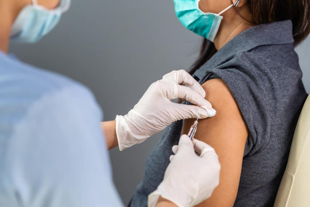 Close Up Doctor Holding Syringe And Using Cotton Before Make