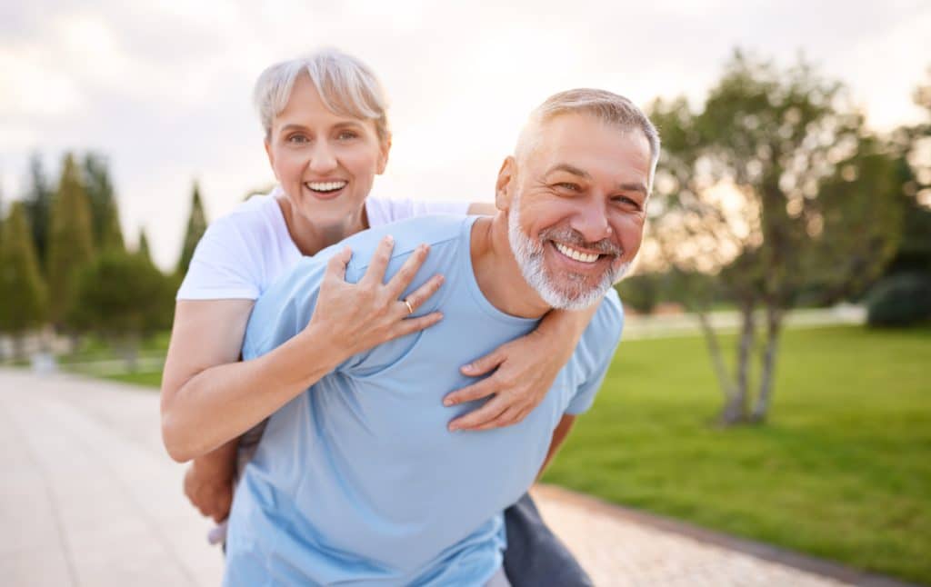 Portrait Of Lovely Happy Elderly Couple On Morning Run Outside