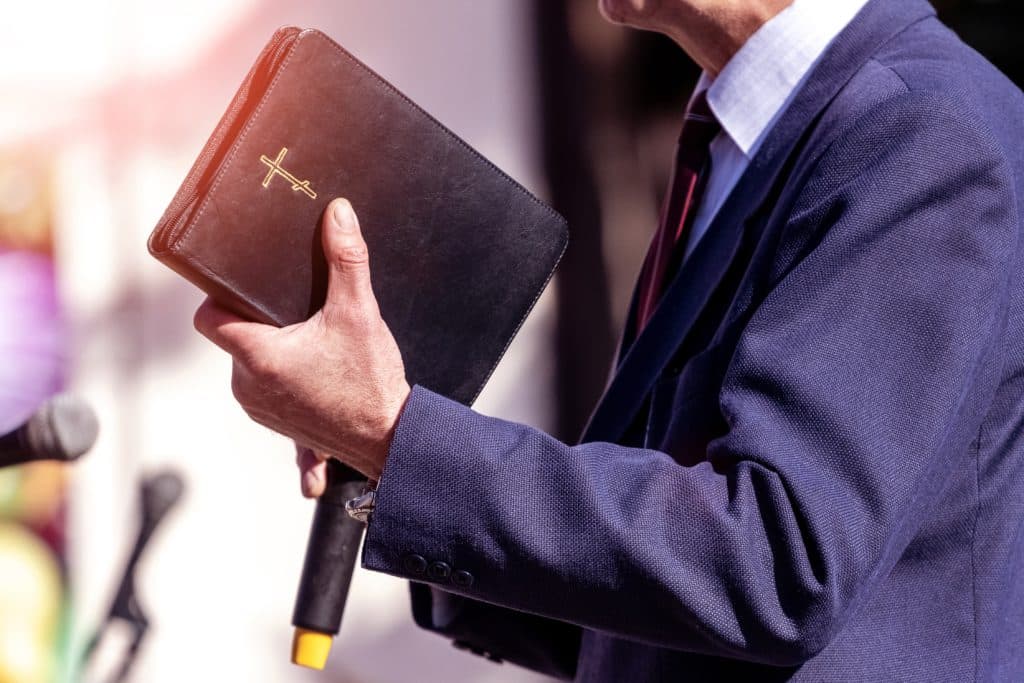 Pastor With A Bible In His Hand During A Sermon.