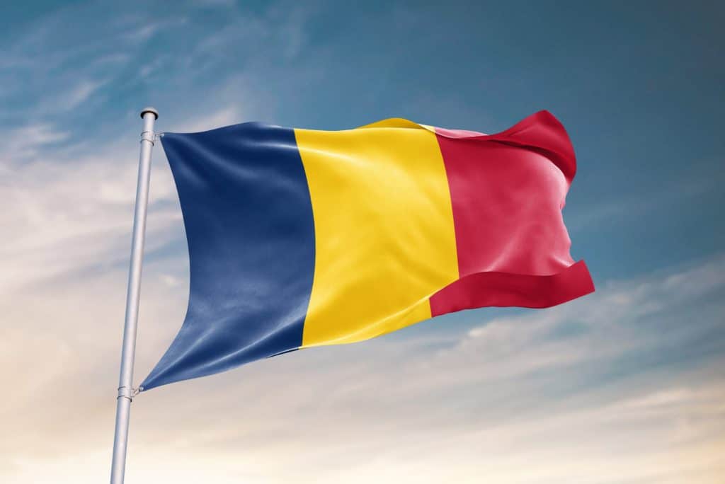 Waving Flag Of Chad In Beautiful Sky. Chad Flag For