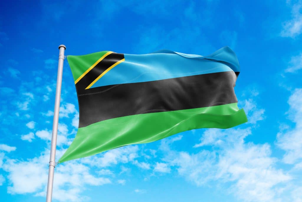 Zanzibar Flag Waving In The Wind Blue Sky Background