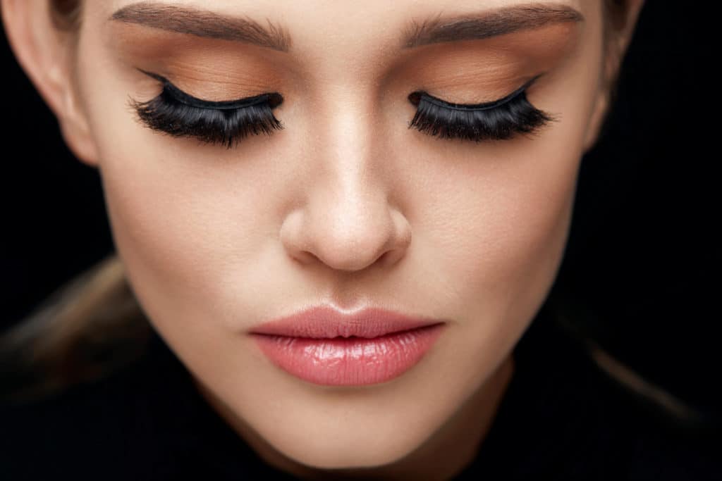 Long Black Eyelashes. Portrait Of Beautiful Woman Face With Closed