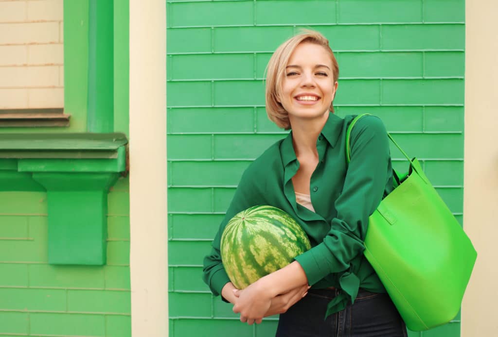 Young Happy Hipster Woman In Green Blouse Holding Watermelon On