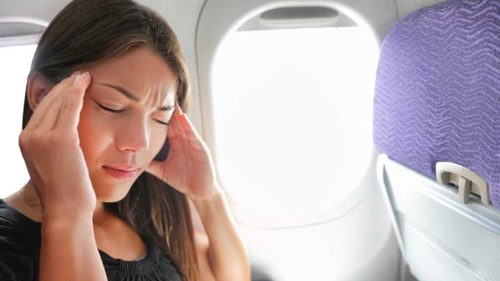 Woman Having Headache In Flight