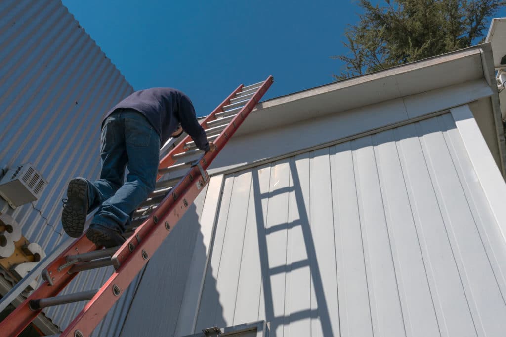 Risks Of A Worker Climbing Uninsured Ladder To Work On