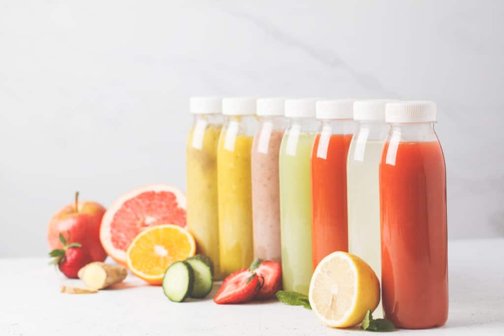 Variety Colorful Smoothies Or Juices Bottles From Berries Fruits And
